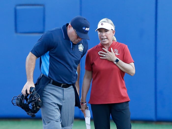 Jun 8, 2021; Oklahoma City, Oklahoma, USA; Oklahoma head coach Patty Gasso talks to the umpire during game one of the NCAA Women’s College World Series Championship Series against Florida State at USA Softball Hall of Fame Stadium.